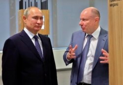 Ruski predsednik Vladimir Putin s metalskim magnatom Vladimirom Potaninom