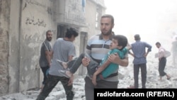 Один из районов в восточной части Алеппо после бомбардировки