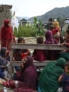 Injured Afghan women and girls sit as they receive medical treatment following an earthquake in the Mazar Dara village in Kunar province, Afghanistan.