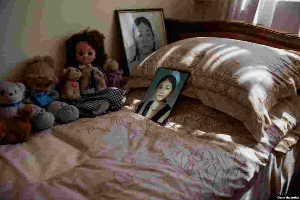 Time has stood still in Oksana Kokova's bedroom. Her father, Ruslan, likes to keep her door open. Oksana managed to escape after the explosions on the third day, but she returned to the school to help the younger children flee. She was killed in the process. Oksana was talented at sports, and loved karate and knitting. Living alone with her father and older brother, she had become accustomed to taking care of the house. She was friendly and talkative; she liked to take charge. Oksana was 15 years old. 