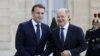 Cancelarul german Olaf Scholz (dreapta) a fost printre primii care a plecat de la summitul organizat de președintele francez Emmanuel Macron, nemulțumit de faptul că se discutau concepte de menținere a păcii în Ucraina ca după un acord, deși încă nu există o înțelegere.
