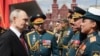 In a photo distributed by Russian state agency Sputnik, Russian President Vladimir Putin greets military commanders after the Victory Day military parade on Red Square in Moscow on May 9.