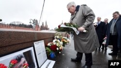 U.S. Ambassador to Russia John Tefft lays flowers at the site where Russian opposition leader Boris Nemtsov was shot dead to mark the second anniversary of his assassination, in Moscow on February 27.