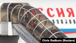 Adults and children board an aircraft sent to collect diplomats and their families from Russia's embassy in London who were expelled by Britain last week after the poisoning of former Russian intelligence officer Sergei Skripal and his daughter Yulia. Now, the U.S. and other NATO allies are also expelling some Russian diplomatic staff.