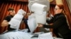 Members of a local electoral commission empty a ballot box at a polling station after the last day of parliamentary elections in Moscow on September 19.