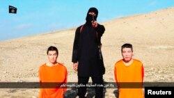 Один из боевиков называет условие освобождения японских заложников 20 января