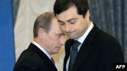 Russia – Russian President Vladimir Putin (L) passes by Vladislav Surkov, deputy head of the Kremlin administration during a meeting of the Culture and Art Council in the Kremlin in Moscow, 30 May 2007