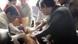 A schoolboy who was injured in a Taliban attack receives medical treatment at a hospital in Peshawar.