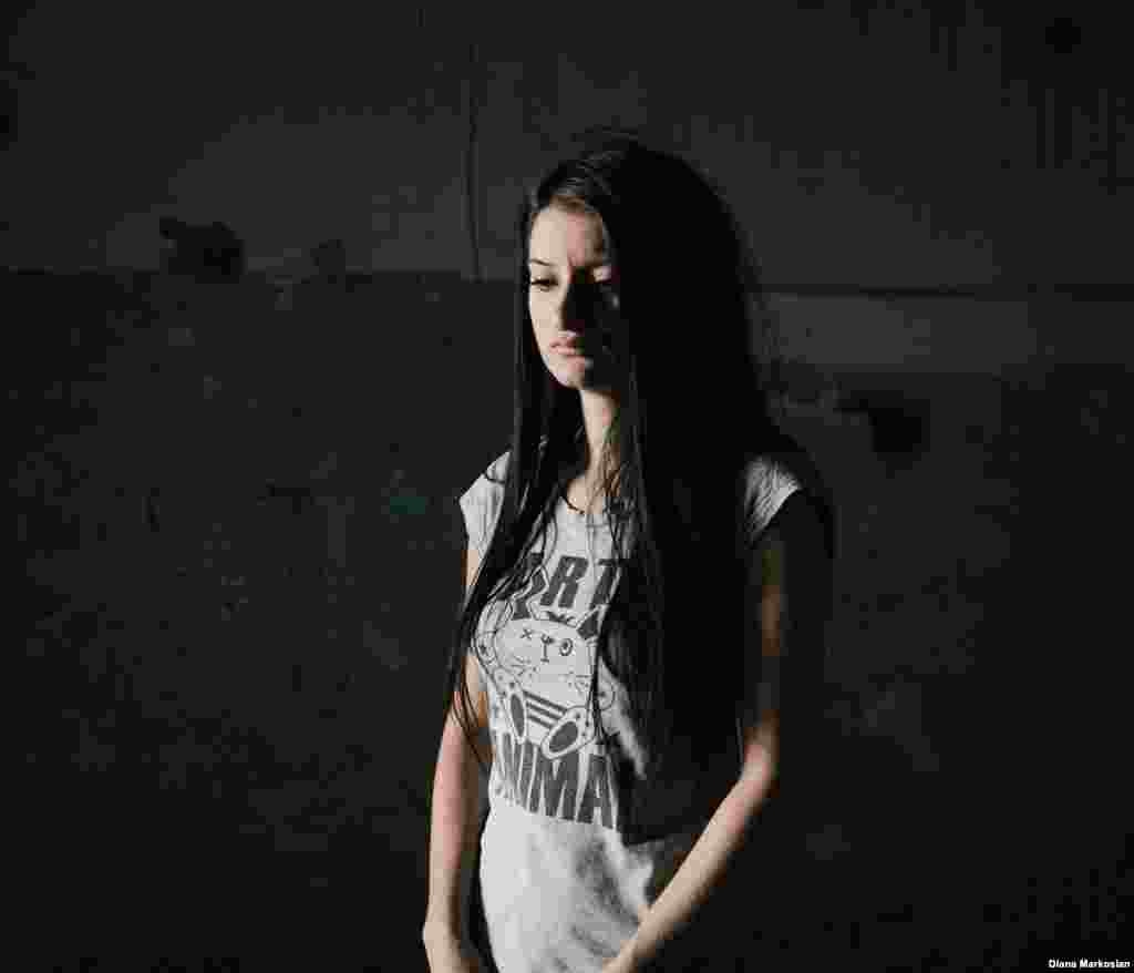 Kristina Dzgoyeva was 11 when she went to the first day of school with her 10-year-old sister, Dzera, and their mother. They stayed close together in the gymnasium after they were taken hostage, but got separated from each other after the explosions on the third day. Kristina and her mother survived, but Dzera died at the school. The family had always lived next to the school, but after the attack, they moved several blocks away. Kristina, pictured here in her old classroom, keeps all of her memories about the siege written down in a diary. Ten years later, she is studying in Moscow and prefers to be far from Beslan. "I don't want anything back here," she says.   