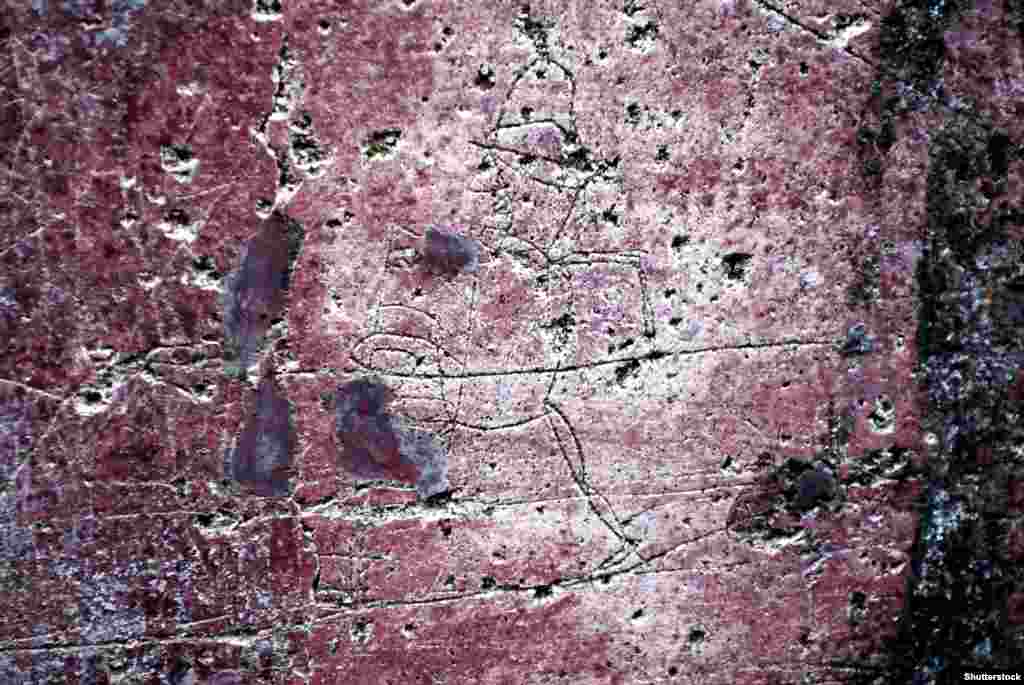 Изображение гладиатора на стене в Помпеях. "Мерриам-Вебстер" (американская компания, издающая справочники и лексические словари. – Ред.) дает такое определение граффити: "Обычно это неразрешенные надпись или рисунок в общественных местах".